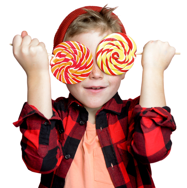 Child holding lollipops over his eyes that looks like bug eyes