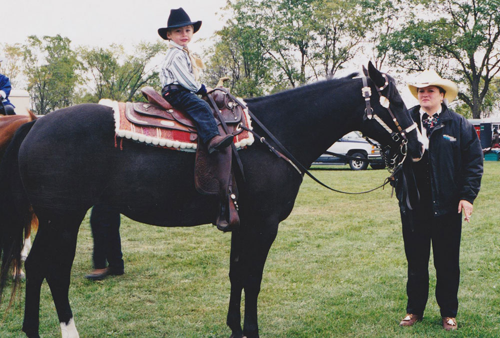 Young boy riding a horse